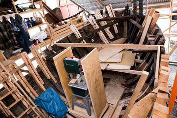 repairing old wooden fishing boat. Large ocean boat. Traditional Scandinavian wooden ships. ship repair workshop. 