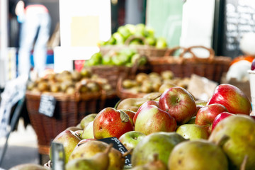 Fresh apples on display at a fruit stand of Borough Market in London