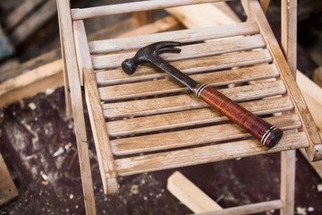 repair old wooden fishing boat. Large ocean boat. Traditional Scandinavian wooden ships. ship repair workshop. hammer tools
