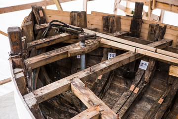 repair old wooden fishing boat. Large ocean boat. Traditional Scandinavian wooden ships. ship repair workshop.