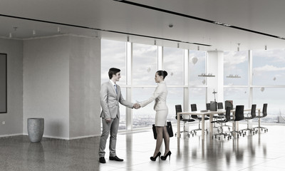 Business partners greeting each other . Mixed media