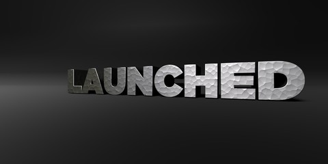 LAUNCHED - hammered metal finish text on black studio - 3D rendered royalty free stock photo. This image can be used for an online website banner ad or a print postcard.