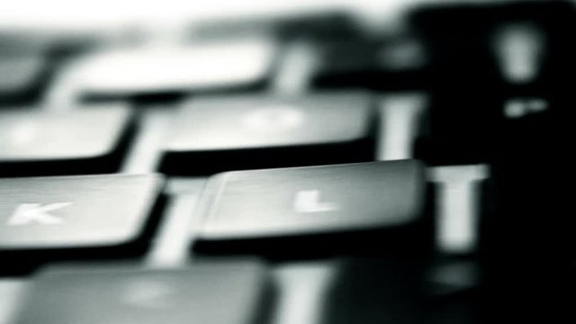 Smooth Slider Shot Panning Across A Computer Keyboard