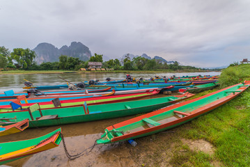 Fototapeta na wymiar long tail boats on Song river, Vang Vieng, Laos