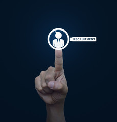 Hand pressing businessman with magnifying glass icon over blue b