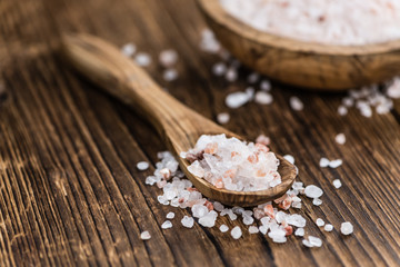 Wooden table with Pink Salt (selective focus)