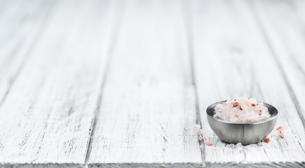 Wooden table with Pink Salt (selective focus)