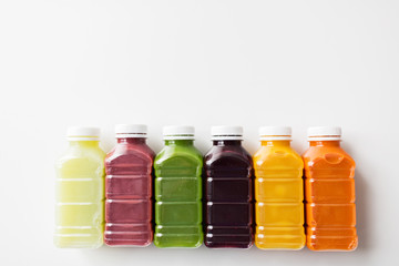 bottles with different fruit or vegetable juices