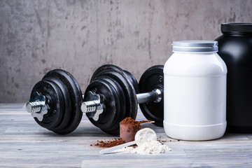 Classic black dumbbells with protein jars