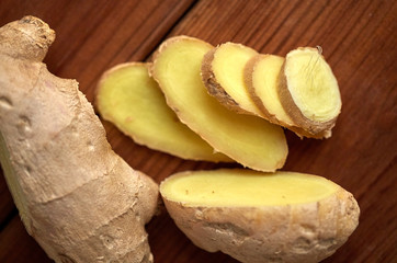 close up of ginger root on wooden table