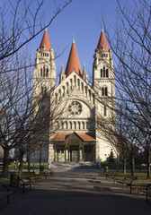 Frontal view of St.Francis of Assisi church in Vienna in winter season, with tree branches and nobody around