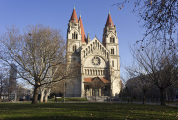 St.Francis of Assisi church and its park in Vienna in winter season, with bare trees