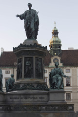 Fototapeta na wymiar Architectural close up of the statue of Emperor Franz I in courtyard of Amalienburg Palace of Hofburg complex, Vienna