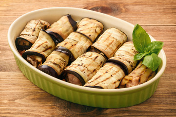 Casserole with roasted eggplants stuffed with minced meat. Cooking process.
