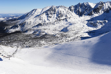 winter going over the high mountain and paths from skies and snowboard covered by snow - Tatra landscape, Zakopane, Alps, the peak of the Ama Dablam massif - Everest region, Nepal Himalayas