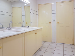 Public toilet design with beige colour.
