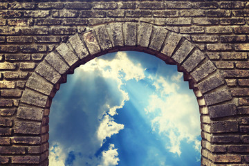 Background sky looking through an old brick window.