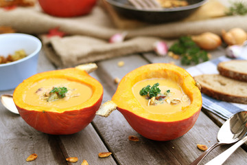 Fresh homemade pumpkin soup served in the pumpkin shell