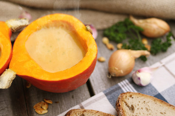 Fresh homemade pumpkin soup served in the pumpkin shell