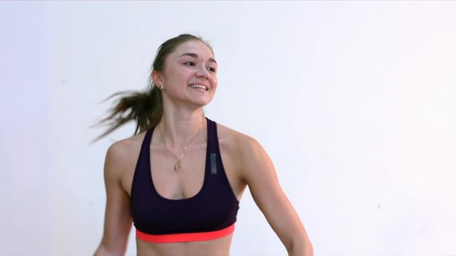 Step Aerobic. Tops. Slow motion. Young women in an aerobics class

