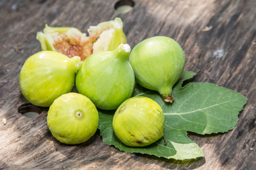 Ripe fig fruits on the wooden table.
