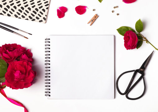 Roses, empty notepad and cute little things