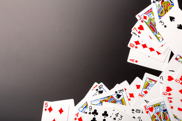 poker chips and cards on black background