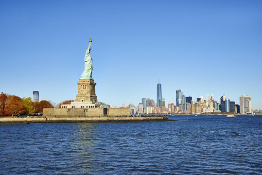 Statule of Liberty on Manhattan landscape