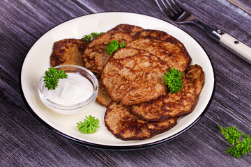 Liver Patties with Sour Cream and Parsley. Liver Cakes or Fritters of Liver. Healthy snack or take-away lunch bites