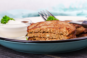 Liver Patties with Sour Cream and Parsley. Liver Cakes or Fritters of Liver. Healthy snack or take-away lunch bites
