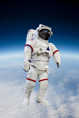 Obraz premium astronaut wearing pressure suit in a space background