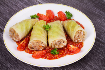 Cabbage rolls with meat, rice and vegetables in tomato sauce. Stuffed cabbage leaves with meat. Dolma, sarma, sarmale, golubtsy or golabki - traditional and popular dish in many countries
