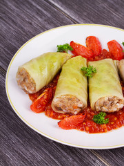 Cabbage rolls with meat, rice and vegetables in tomato sauce. Stuffed cabbage leaves with meat. Dolma, sarma, sarmale, golubtsy or golabki - traditional dish in many countries