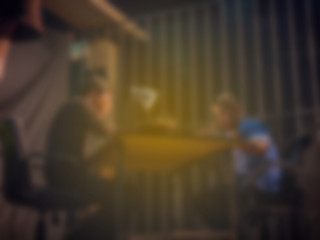 Blurred background Policeman trying to force the suspect man tell the truth