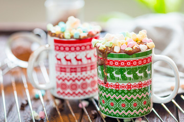 Two Cups of Chocolate Coffee Drink with Spices and Mini Marshmallows on Dark wooden Background, Free Space for text, Christmas Background