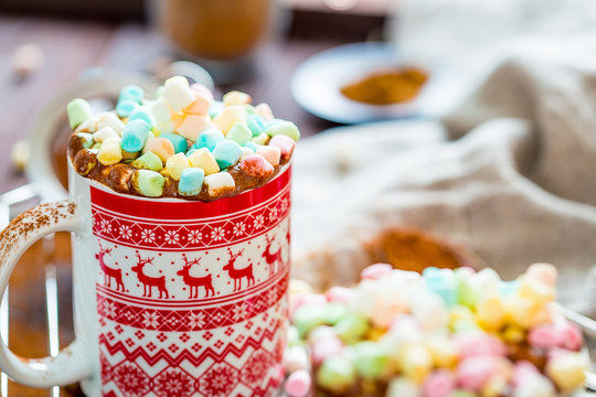 Hot Chocolate with Cinnamon and Marshmallows in a Christmas Red Mug, Close-up View, Free Space for Text