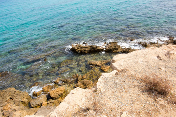 Fototapeta na wymiar Stone cliff in a beautiful blue sea Cyprus