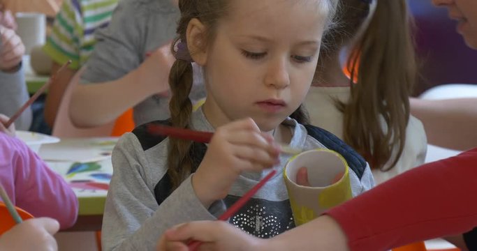 Close up Girl Painting Cylinder.