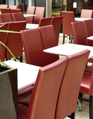 Empty restaurant inside of a shopping mall.