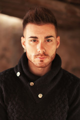 Obraz premium Portrait of attractive guy in a old house