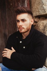 Portrait of attractive guy in a old house.