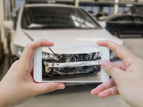 female hold mobile smartphone photographing car accident