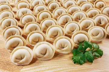 Dumplings and parsley - russian pelmeni - italian ravioli