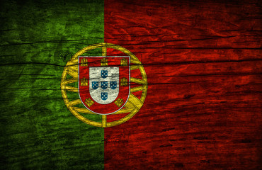 The national vintage flag of Portugal on wooden surface