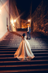 Pretty bride stands on steps