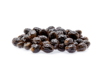 Papaya seeds on white background.