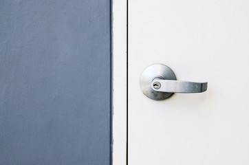 Closeup metal door with lock in grungy style and good texture.