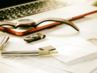 Close up of modern working table of businessman with notebook, p