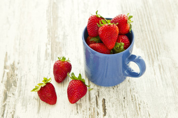 Mug filled with sweet strawberries