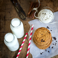 Homemade oatmeal cookies with chocolate and milk